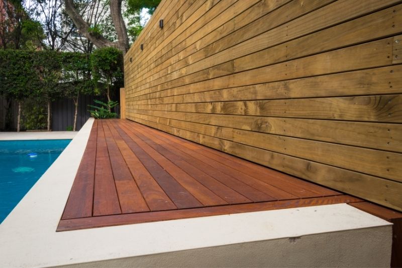 A timber deck around a pool