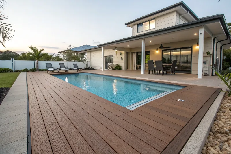 Non-slip timber pool deck surface showing water-resistant hardwood decking beside pool