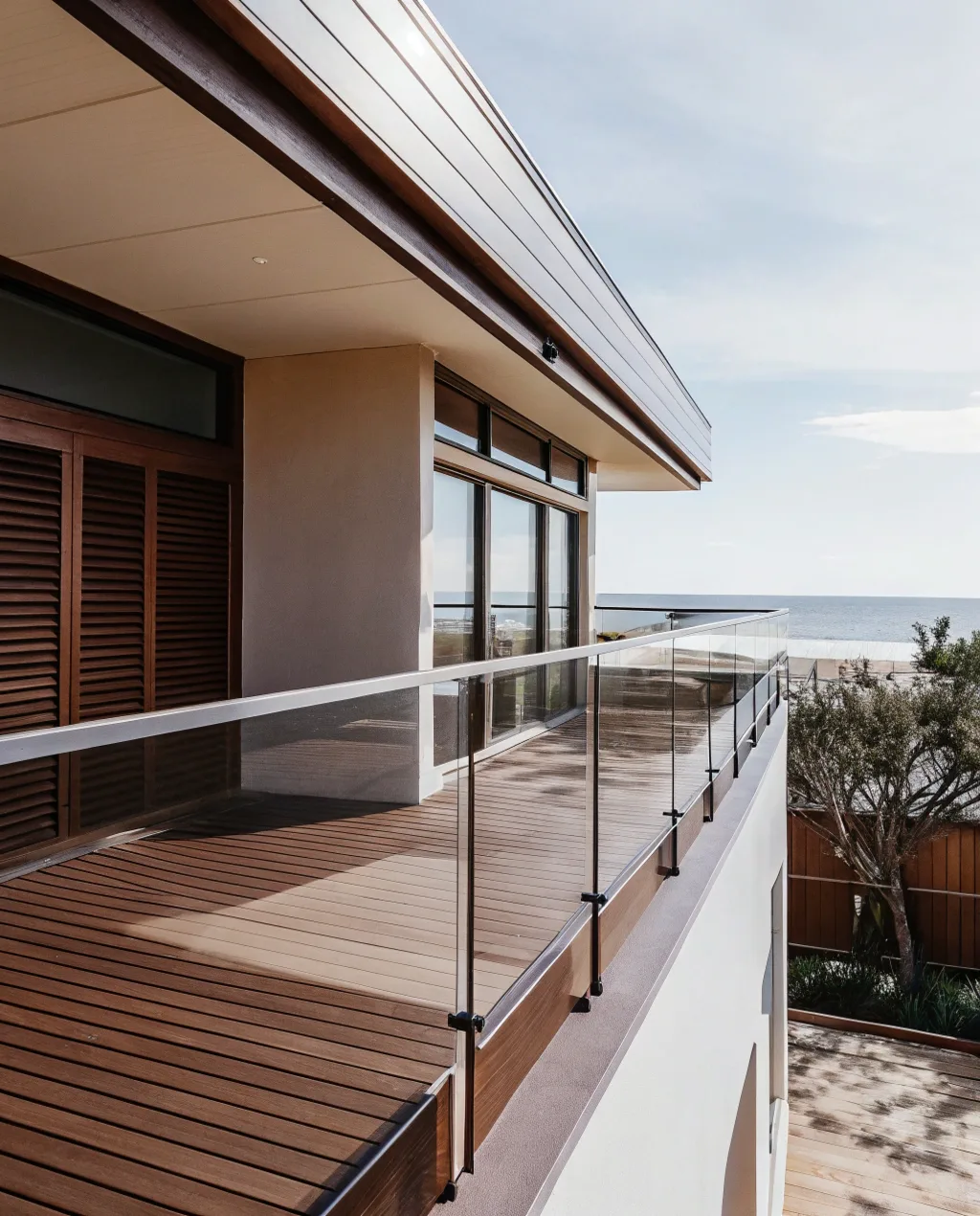 Modern second-storey balcony with glass balustrade