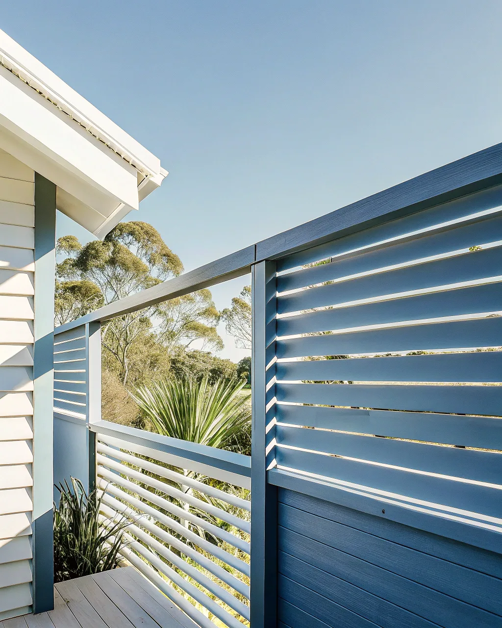 Modern timber privacy screens attached to a deck railing